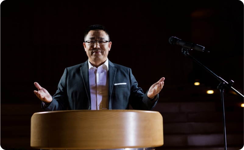 businessperson delivering speech